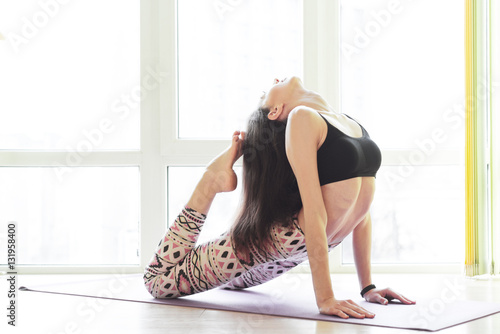 young beautiful woman yoga posing
