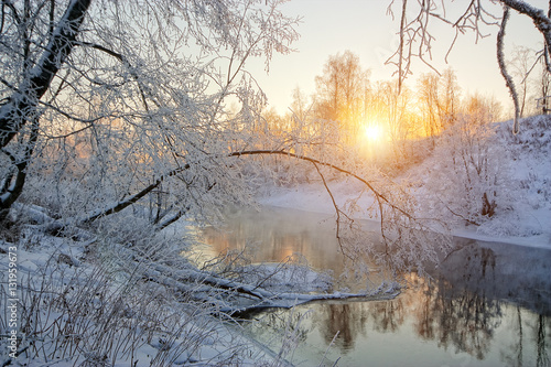 The sun's rays in a frosty morning on the river