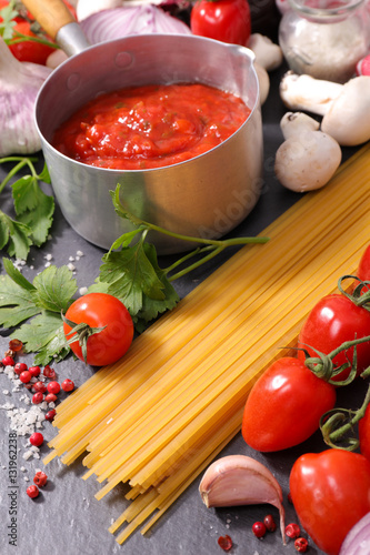 raw spaghetti with tomato sauce