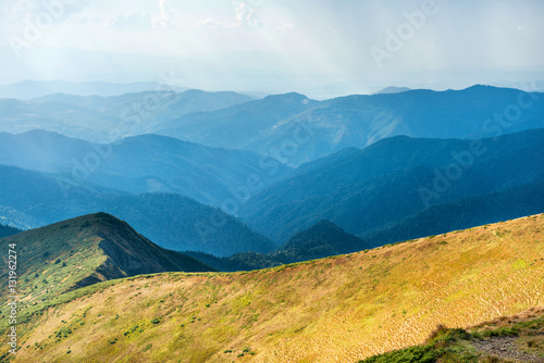 Mountain range with dry yellow grass © Pavlo Vakhrushev