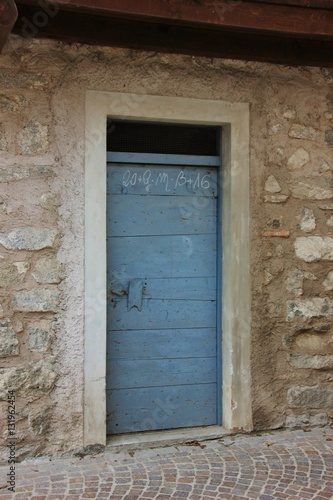 Blue wooden door. Rango, Trentino, Italy © Renzo