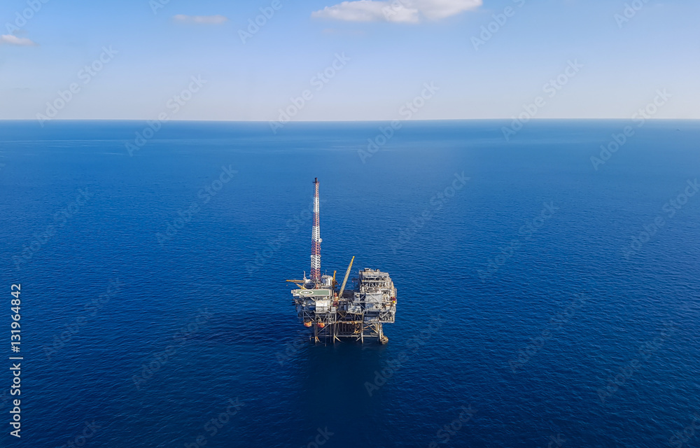 Image of oil platform while cloudless day - aerial view