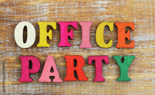 Office party written with colorful wooden letters
