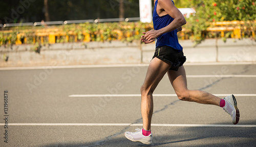 fitness male marathon runner running on city road © lzf