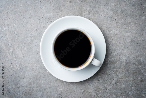 Cup of coffee on gray stone table