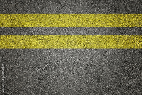 Two yellow stripes on asphalt © Stock Photos & Video