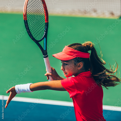 Girl playing tennis © Microgen