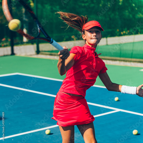 Girl playing tennis © Microgen