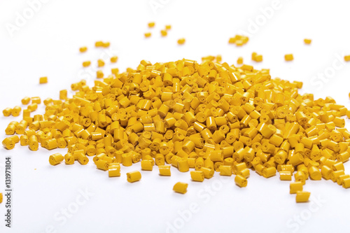 Polymeric dye for plastics. Pigment in the granules on a light background. 