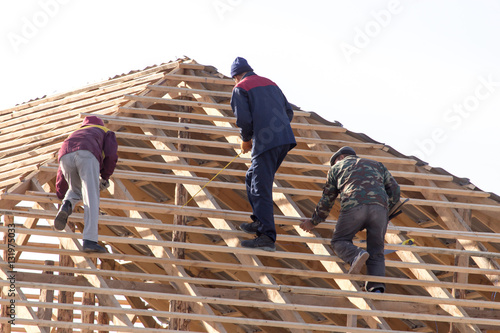 Wallpaper Mural workers working on the roof Torontodigital.ca