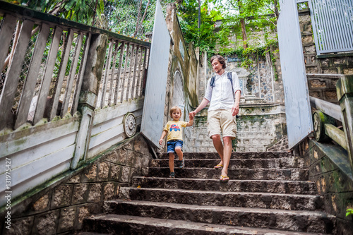 Happy tourists dad and son in LongSon Pagoda photo