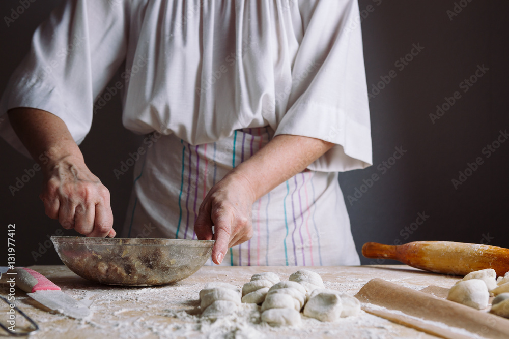 Front view of woman's hands making meat stuffing for dumplings. Front view of woman's hands making meat stuffing for dumplings.