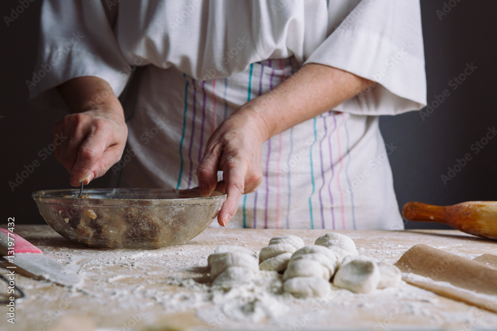 Front view of woman's hands making meat stuffing for dumplings. Front view of woman's hands making meat stuffing for dumplings.