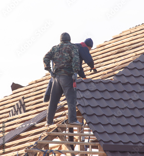 Wallpaper Mural workers working on the roof Torontodigital.ca