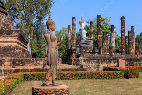 Walking Buddha statue at Wat Sa Si, Shukhothai Historical Park, photo