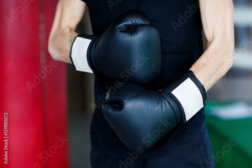 Hands of boxer in gloves © snedorez