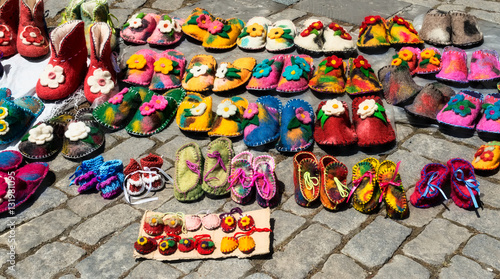 Handmade georgian felt shoes on the block stones