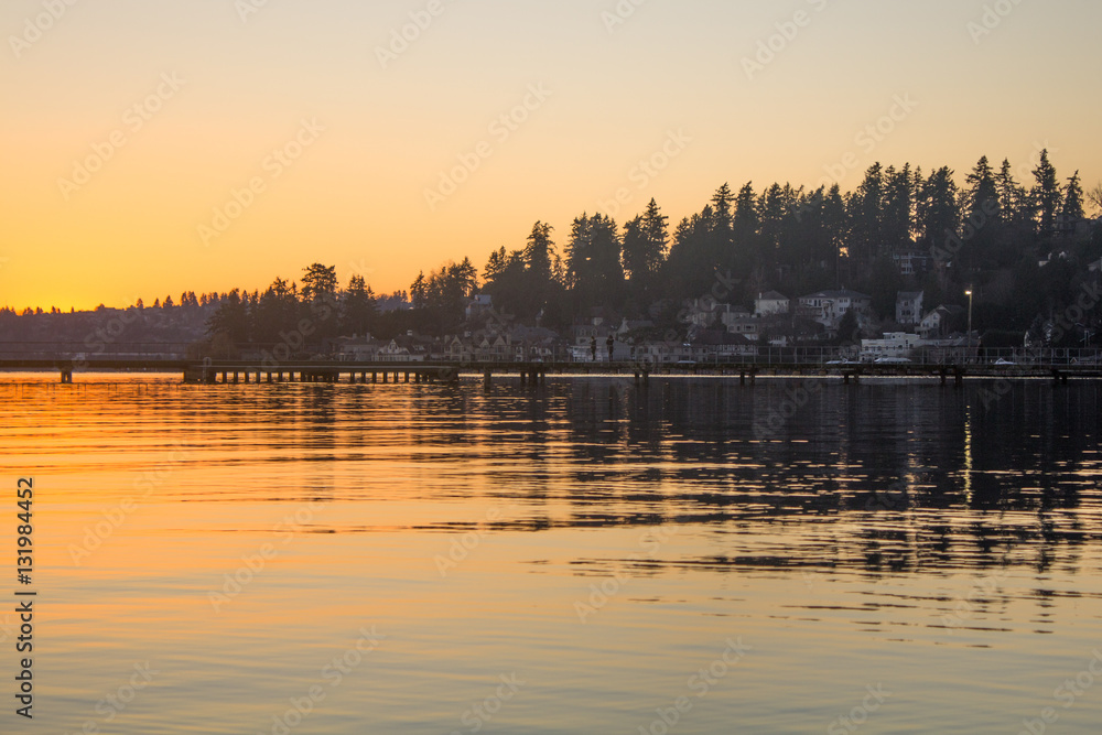 Naklejka premium A pier over a lake in a winter sunset at Juanita Bay Park, Kirkland, Washington