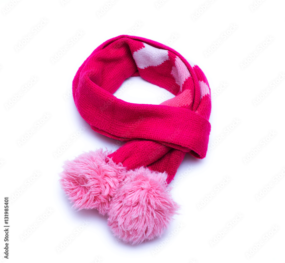 Fototapeta premium Knitted red scarf with pompoms with on white background.