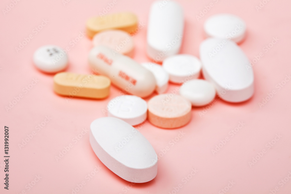 Pills on a pink background Pills on a pink background