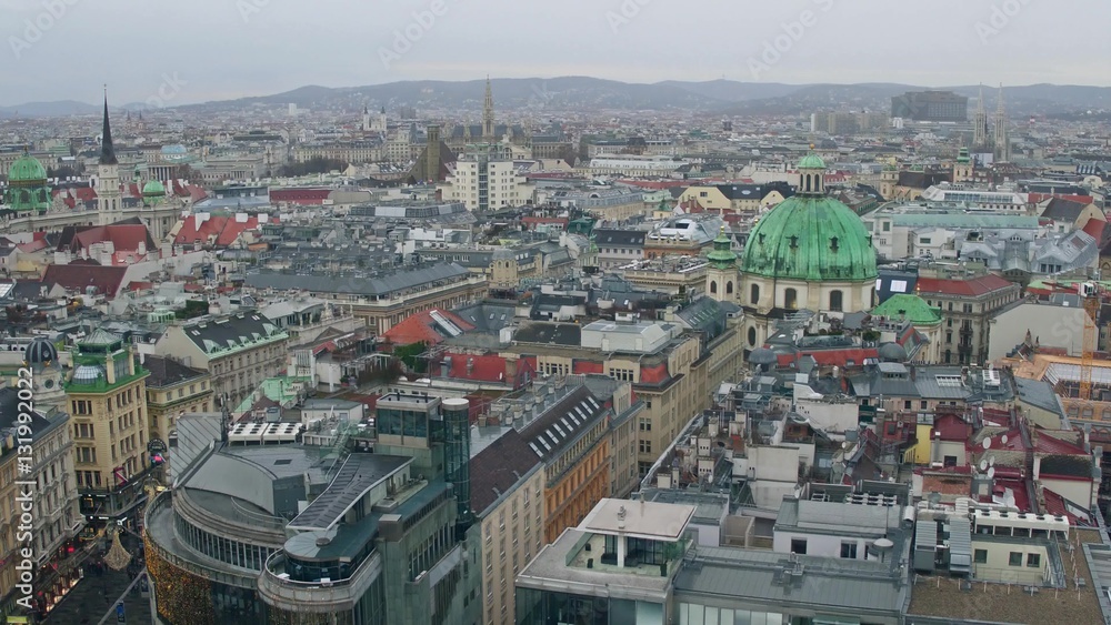 Old low-rise and modern buildings' roofs in Vienna on a cloudy day, Austria