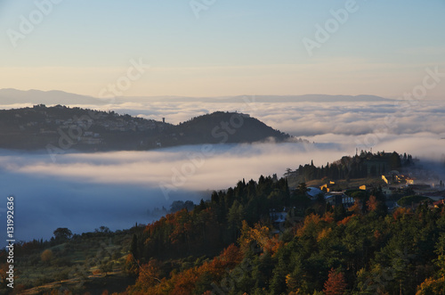 Fog in the valleys near Florence at sunrise.