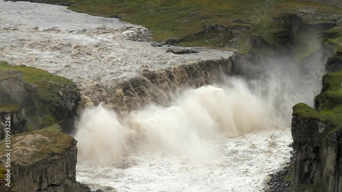 Hafragilsfoss is a powerful waterfall in Iceland. The waterfall flows downstream from Dettifoss within the depths of the Jökulságljúfur canyon. Drop: 27m (89 feet) and width: 91m (300 feet) photo