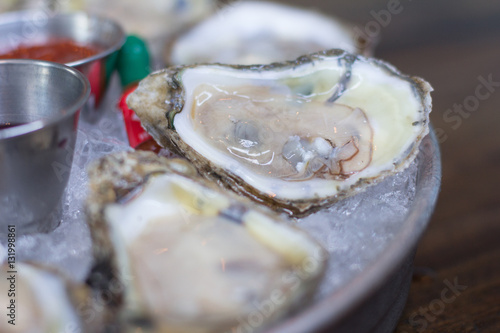 Chesapeake Bay, Oysters, served chilled with red wine mignonette,.cocktail sauce & fresh lemon photo