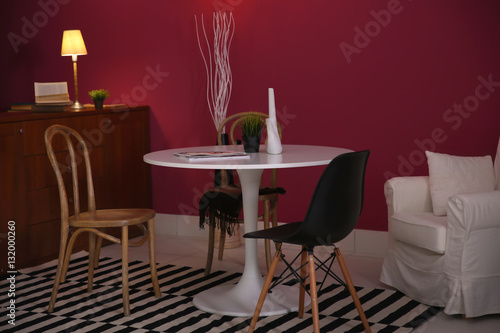 Modern interior on marsala wall background © Africa Studio