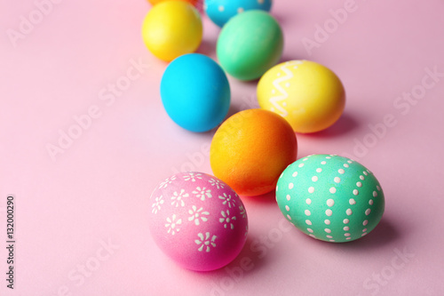 Colorful Easter eggs on pink background