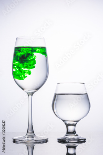 Wine glass There are two color green white , isolated on gray ba