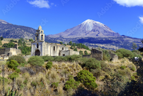 Pico de Orizaba volcano, or Citlaltepetl, is the highest mountain in Mexico, maintains glaciers and is a popular peak to climb along with Iztaccihuatl and other volcanoes in the country photo