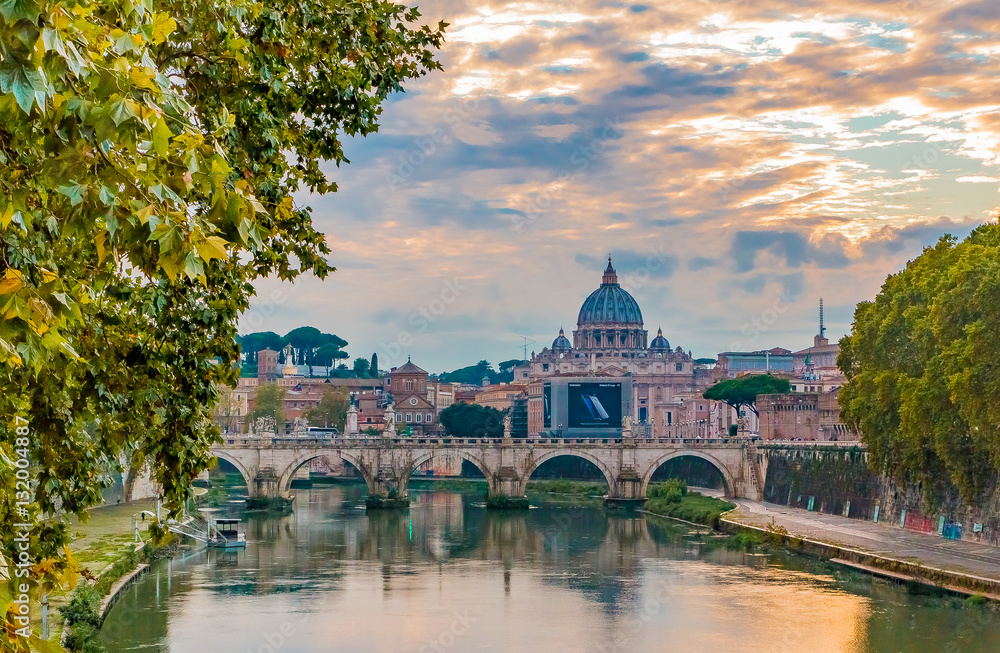 View of St. Peter’s Basilica over Tiber at sunset