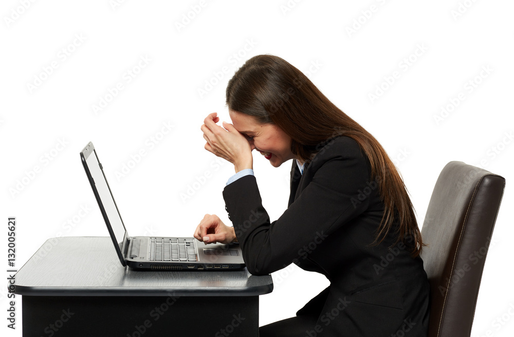 Amused business woman laughing reading on laptop Amused business woman laughing reading on laptop