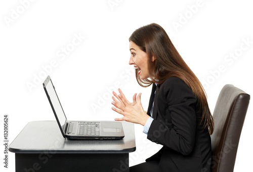 Frustrated young businesswoman at her laptop