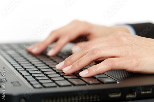 Woman typing on keyboard, closeup