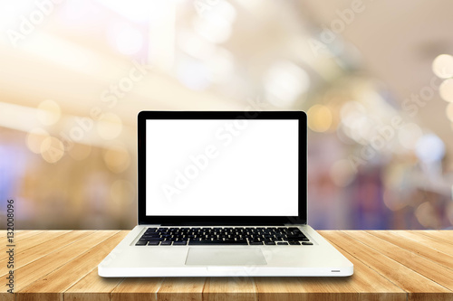 Laptop Empty top wooden table and blur with bokeh background. Fo