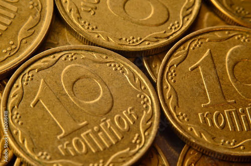 Detailed macro shot of Ukrainian money coins in the form of cash cents. Ukrainian kopeck with detailed metal texture and relief ornament in the form of plants.