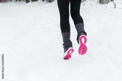 Legs of a runner outside in winter