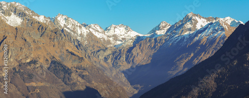 Great landscape on the Orobie Alps in winter season close to Cardeto natural lakes. View of the highest mountains including Pizzo Coca. Seriana Valley, Bergamo, Italy. 