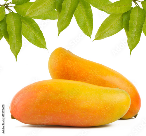 Mango decorated with leaves isolated white background