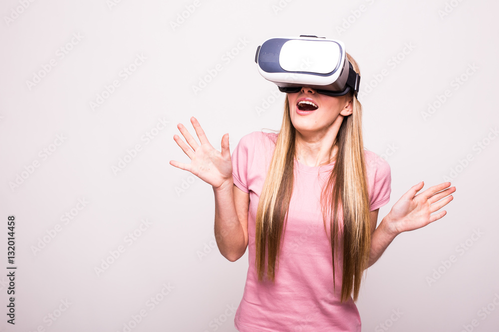 Happy woman wearing virtual reality goggles Happy woman wearing virtual reality goggles