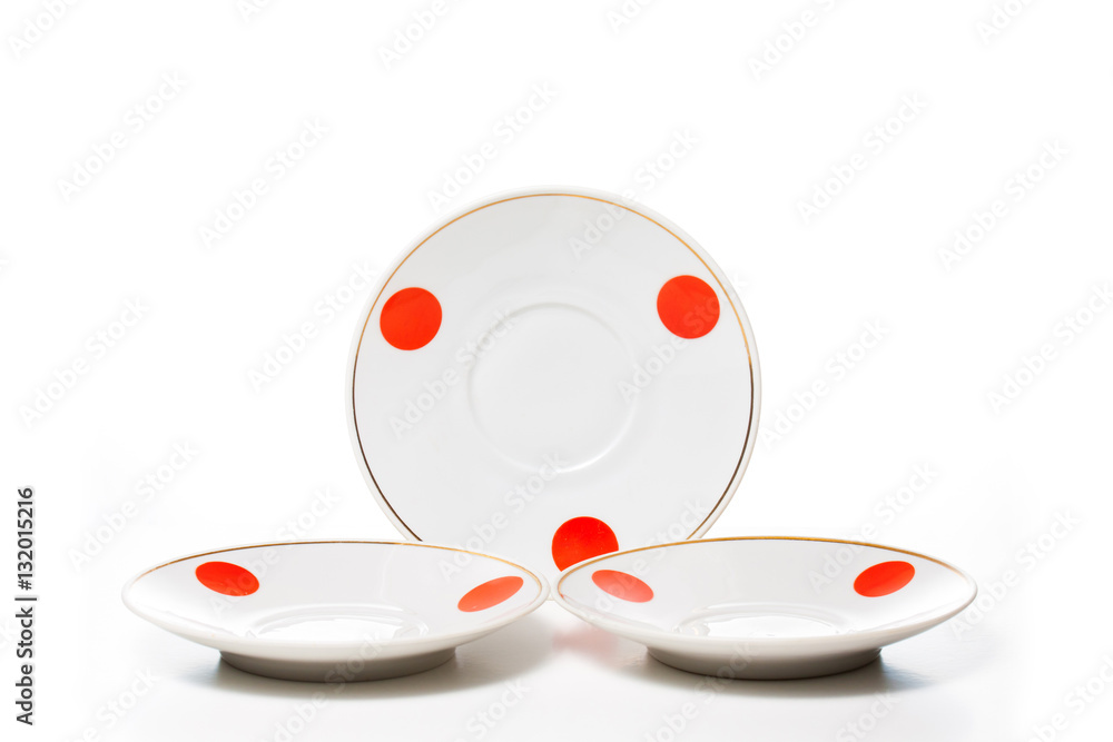 White plates with red polka dots design. Decorative wallpaper White plates with red polka dots design. Decorative wallpaper
