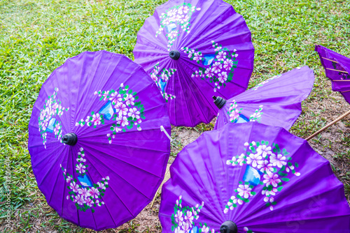 Thai native umbrella on ground photo