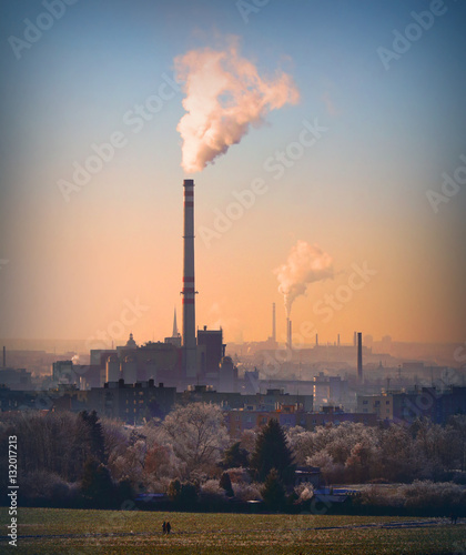 Smoking stack from lignite combined heat and power plant plant (Pilsen). Digital artwork on air pollution and climate change theme. Power and fuel generation in Czech Republic, European Union.