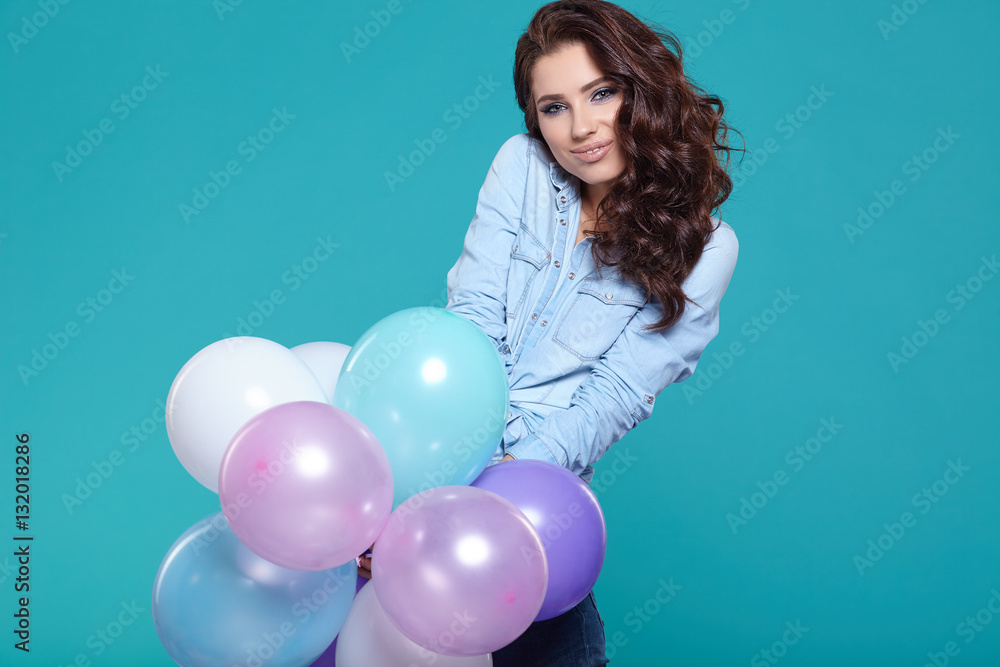 Fototapeta premium Young pretty woman with colored balloons