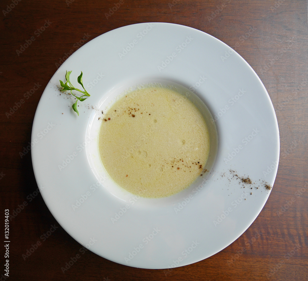 Mushroom soup in white plate top view Mushroom soup in white plate top view