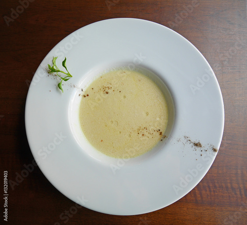 Mushroom soup in white plate top view