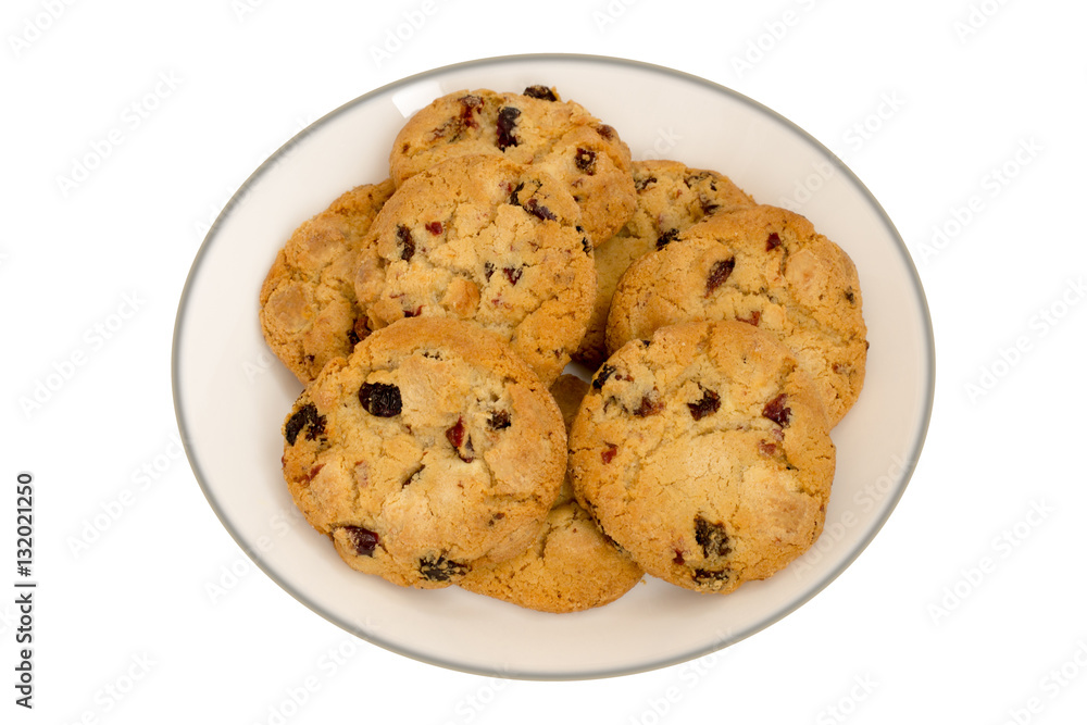 Cookies with raisins on a white plate. Top view