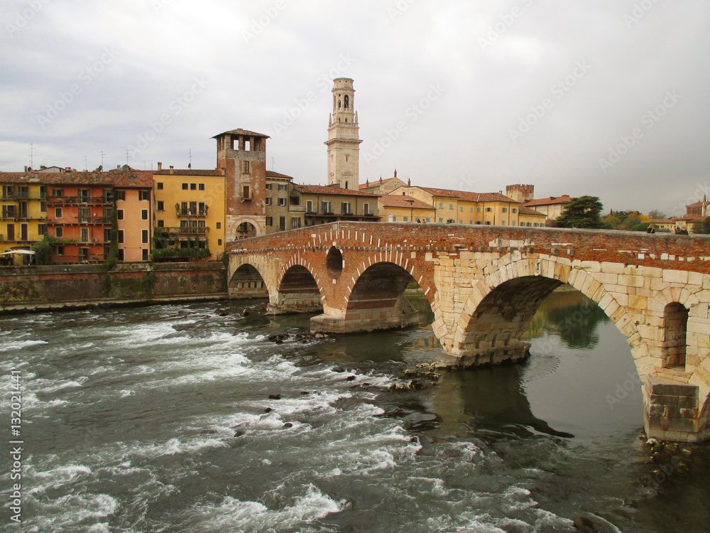 Ponte Pietra, the Roman Arch Bridge over the Adige River in Verona of Italy 